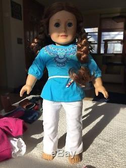 American Girl Saige Doll comes with four outfits including the original dress